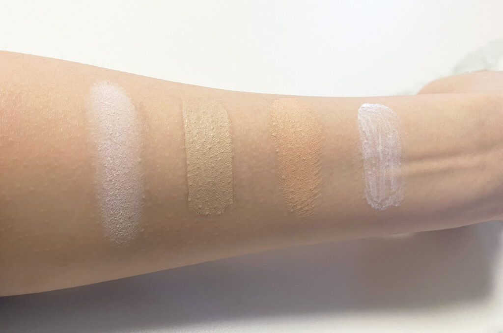 ベースメイクを順番に腕に乗せている写真